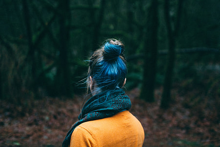 woman in orange top shirt with scarf thumbnail
