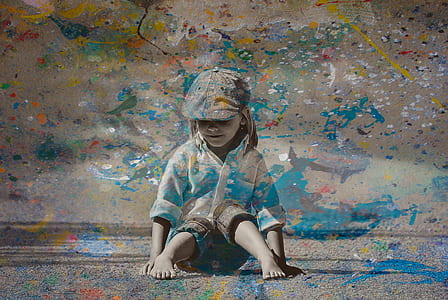 toddler sitting on gray surface thumbnail