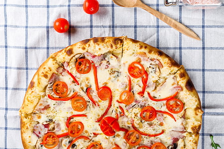 pizza with sliced tomatoes thumbnail