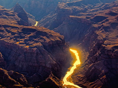 aerial photography of body of water surrounded by rocks thumbnail