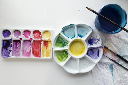water color palette with brush on white table thumbnail
