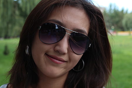 selective focus photo of woman wearing sunglasses on open field thumbnail