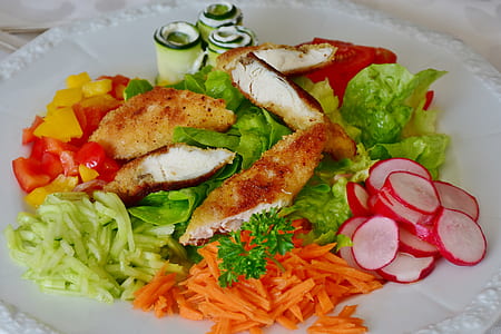 fried chicken with vegetables and fruits on round white ceramic plate thumbnail