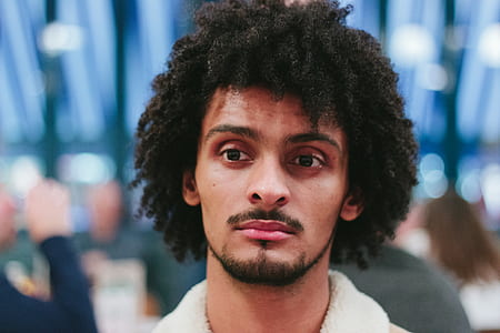 selective focus photo of a man wearing white top thumbnail