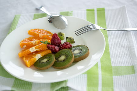 kiwi, orange, and strawberry fruits serving on plate thumbnail