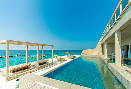 Architectural Photography of Gray Granite Swimming Pool and Outdoor Lounge at Beach Side thumbnail