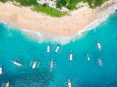 white motor boats on beach thumbnail
