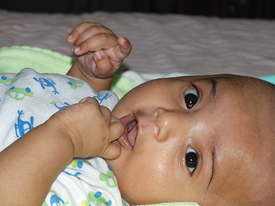 baby touching his lips thumbnail