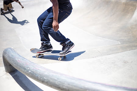 person on gray skateboard during daytime thumbnail