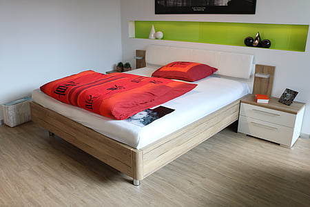 brown wooden bed frame and white mattress thumbnail