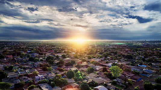 Aerial Photography of Buildings Under Blue and White Sky during Golden Hour thumbnail