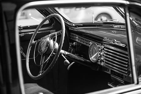 grayscale photo of vehicle steering wheel thumbnail