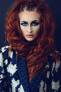 woman in blue and coat thumbnail