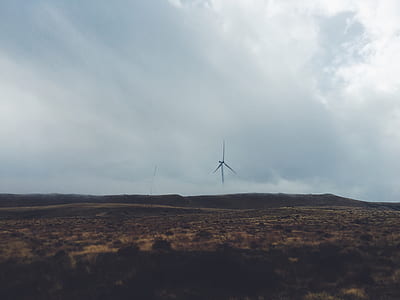 wind turbine on mountain with clouds thumbnail