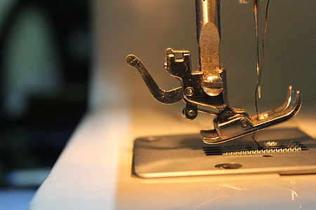 close up photo of gray sewing machine thumbnail