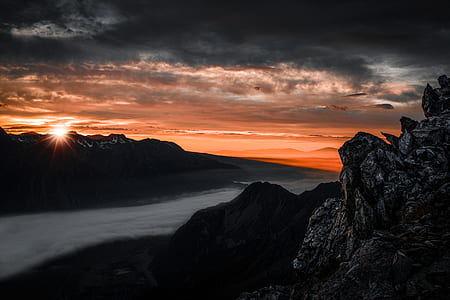 bird's eye view photography of mountain with fogs thumbnail