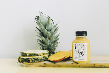 sliced pineapples on white surface thumbnail