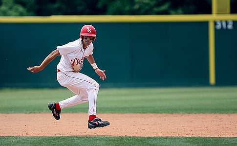 selective focus photography of baseball player on field at daytime thumbnail