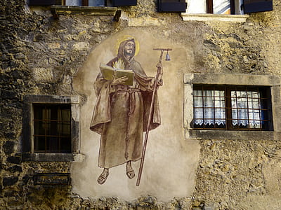 man holding staff and book wall mural thumbnail