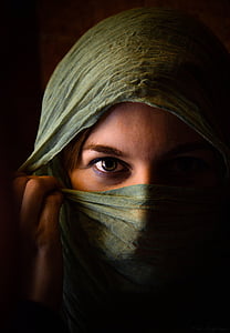 woman wears green headscarf thumbnail