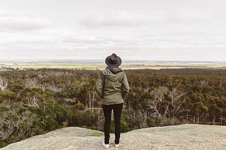 woman standing on top of a hill thumbnail