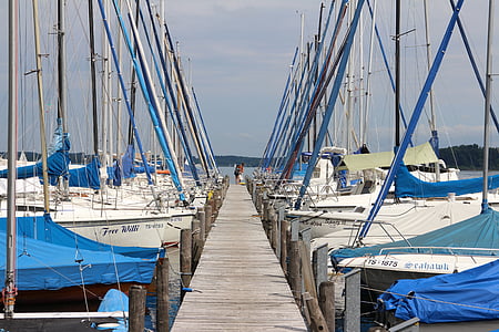 white sailboat near dock thumbnail