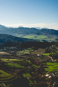 person taking photo of mountain at daytime thumbnail