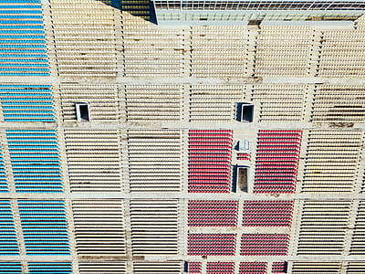 white and red stadium chairs at daytime thumbnail