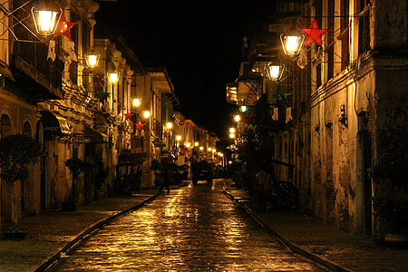 photo of lighted street lights near houses thumbnail