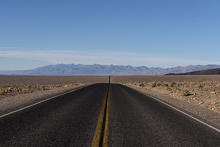 landscape photography of gray concrete road thumbnail