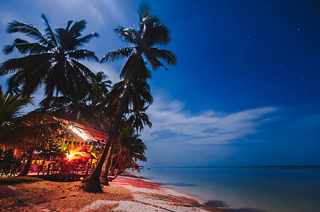 time-lapse photography of house near seashore thumbnail