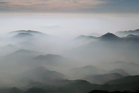 aerial photo of mountains covered with white cloud photo during daytime thumbnail