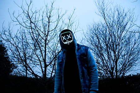 photo of person with bare trees as background thumbnail