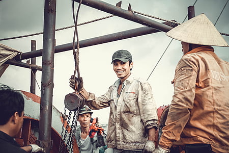 man standing near post while smiling thumbnail