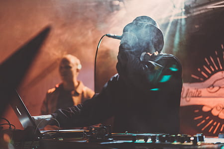 man wearing black jacket singing near laptop thumbnail