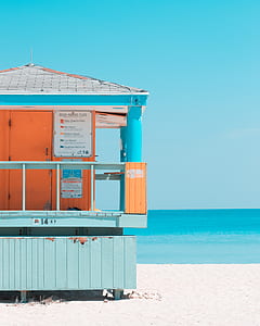 photo of blue lifeguard house on seashore thumbnail