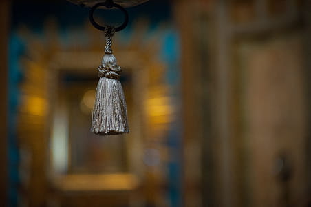 Selective Focus Photograph of Gray Tassel Accessory thumbnail