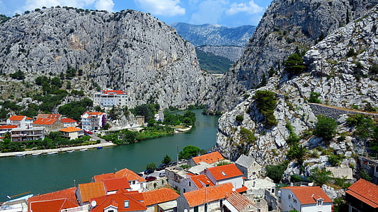 village near mountain thumbnail