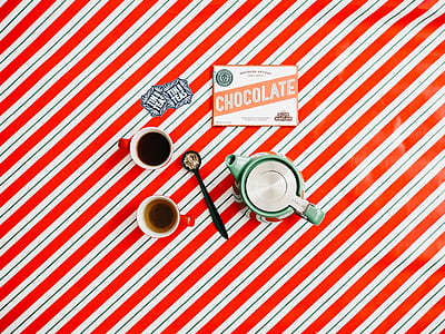 flat lay photography of teapot and coffee-filled teacups thumbnail