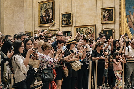 people standing holding cameras at lobby thumbnail