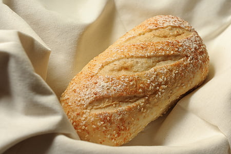 selective focus photography of bread with sesame seeds thumbnail