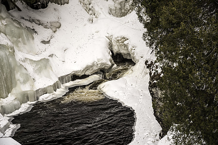 Frozen Water with water coming out of a hole at Cascade River State Park, Minnesota thumbnail