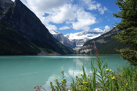 body of water beside mountains thumbnail