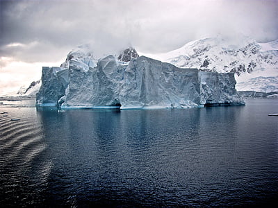 iceberg in the middle of body of water thumbnail