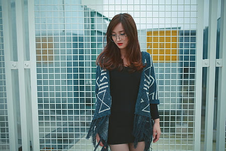 woman wearing blue and white poncho thumbnail