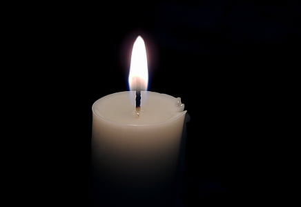 lighted white candle thumbnail