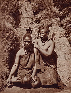 grayscale photo of two tribal women wearing dresses thumbnail
