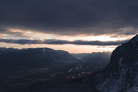 road between mountains at night aerial photography thumbnail
