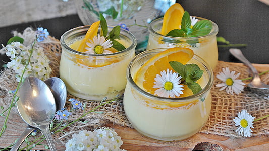 three clear glass filled with yellow liquid and citrus sliced fruit thumbnail