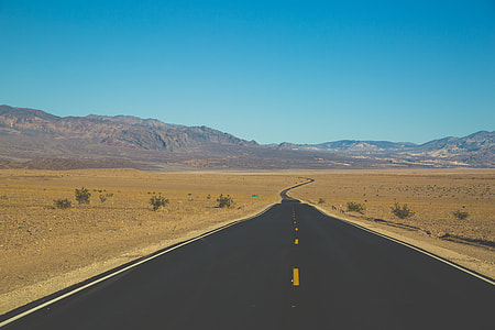 black concrete road at daytime thumbnail
